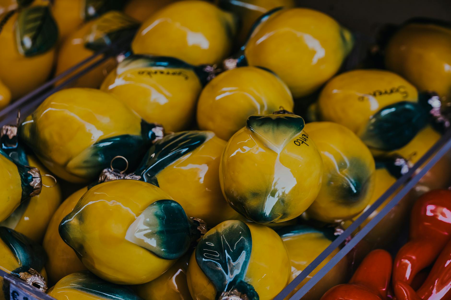 Bright yellow lemons arranged on a pastel green background